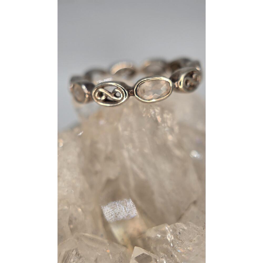 Sterling silver infinity eternity band with quartz gemstone.